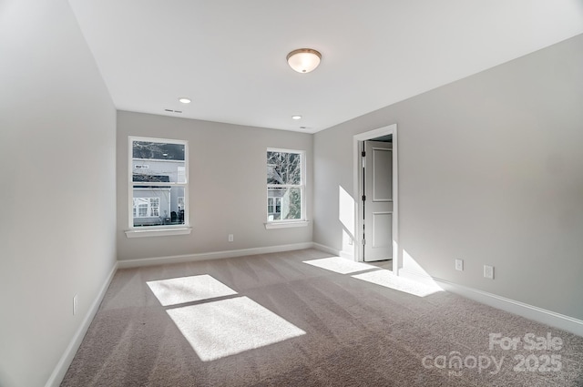 unfurnished bedroom featuring light carpet