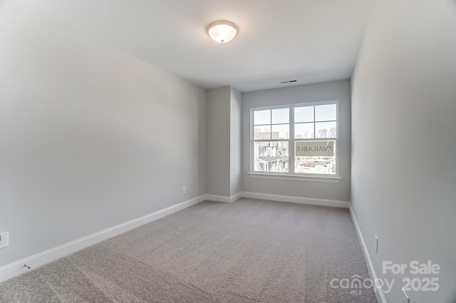 empty room with light colored carpet