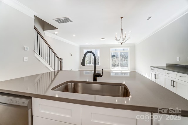 kitchen with decorative light fixtures, sink, crown molding, white cabinetry, and dishwashing machine