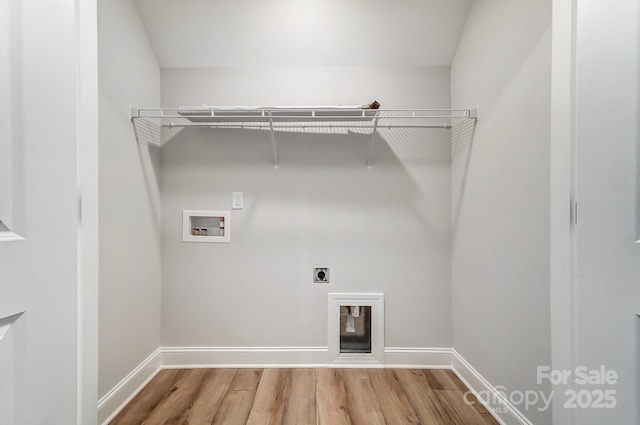 laundry room with washer hookup, electric dryer hookup, and hardwood / wood-style flooring