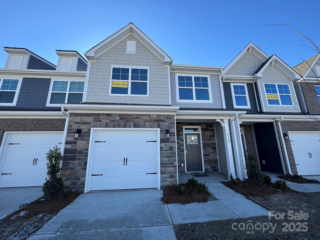 multi unit property featuring a garage