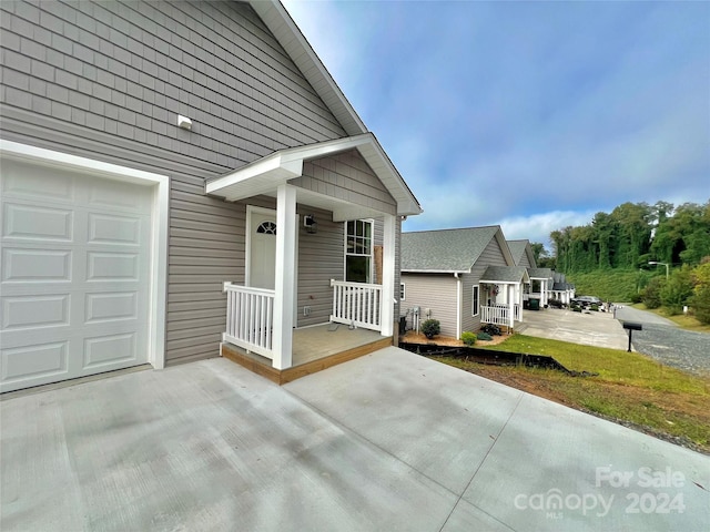 view of exterior entry featuring a porch