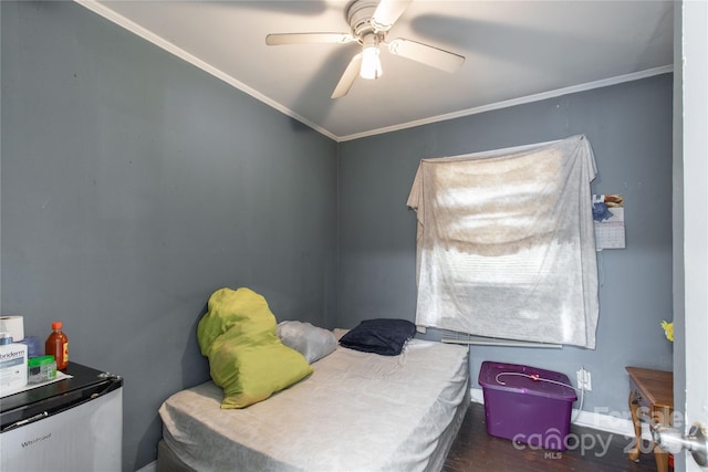 bedroom with ceiling fan, dark wood-style flooring, stainless steel fridge, and crown molding