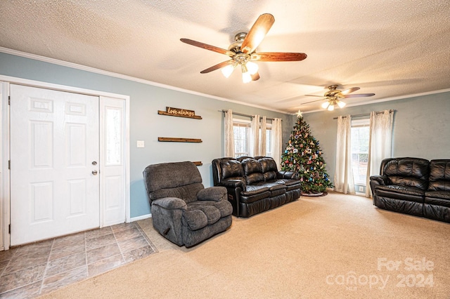 living room with ceiling fan, carpet floors, a textured ceiling, and ornamental molding