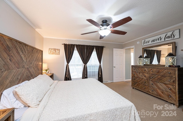 bedroom with a textured ceiling, ceiling fan, and ornamental molding