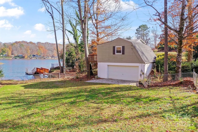 exterior space with a lawn and a water view