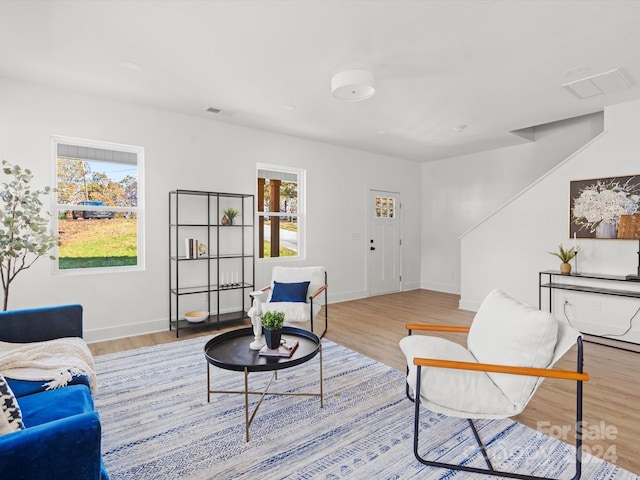 living room with light hardwood / wood-style floors