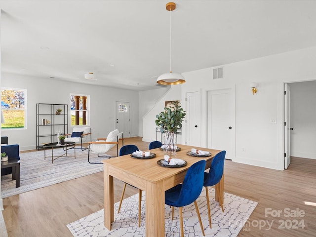 dining room with light hardwood / wood-style flooring