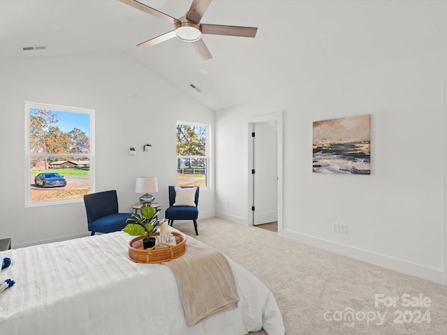 carpeted bedroom featuring ceiling fan and vaulted ceiling