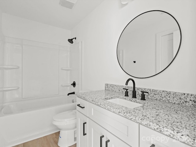 full bathroom with shower / bathing tub combination, toilet, vanity, and hardwood / wood-style flooring