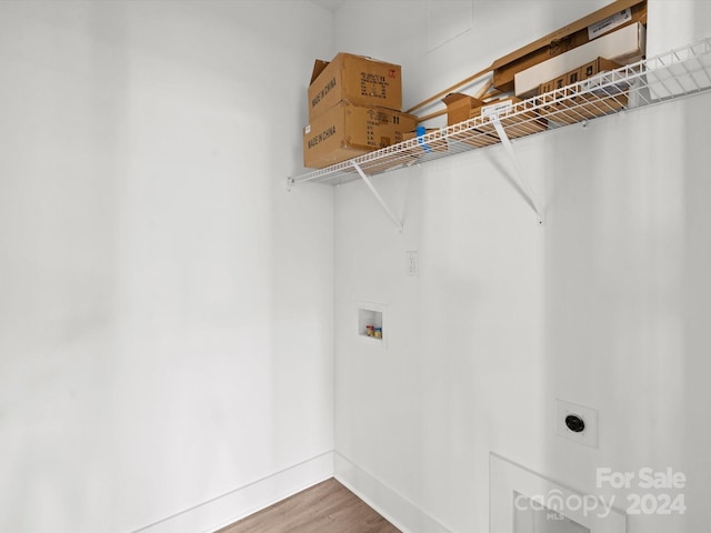 laundry room featuring hardwood / wood-style flooring, electric dryer hookup, and hookup for a washing machine