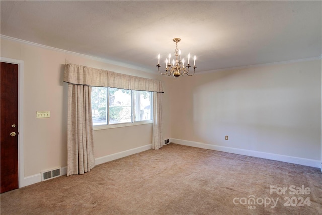 carpeted spare room featuring a chandelier and crown molding