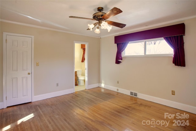 unfurnished room with hardwood / wood-style flooring, ceiling fan, and ornamental molding