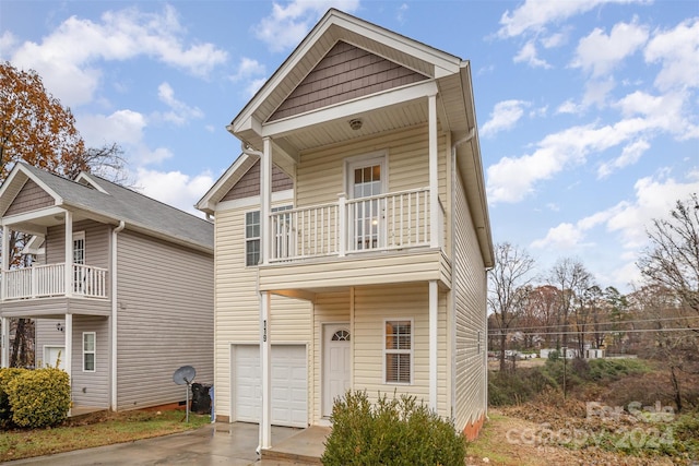 view of front property featuring a garage and a balcony