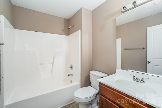 full bathroom with vanity, bathing tub / shower combination, and toilet