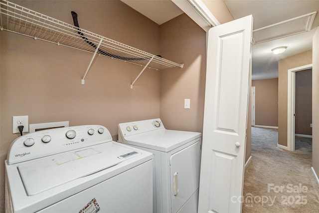 laundry room featuring light carpet and washing machine and dryer