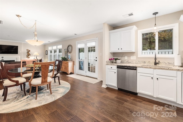 kitchen featuring dishwasher, white cabinetry, sink, and a wealth of natural light