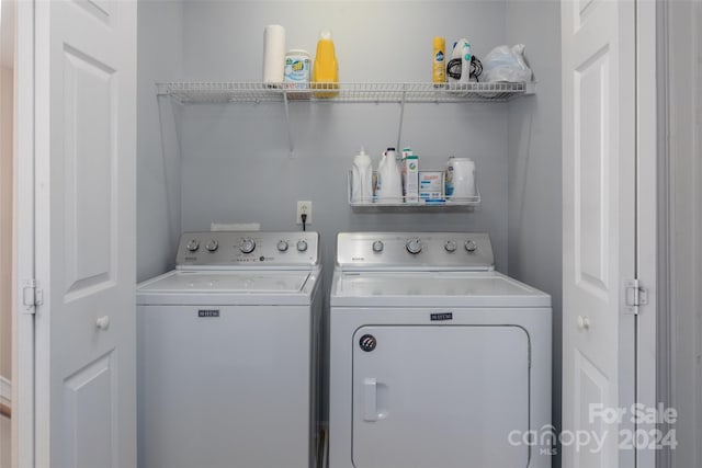 laundry room featuring washing machine and clothes dryer