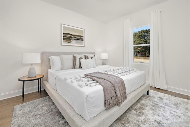 bedroom with hardwood / wood-style floors