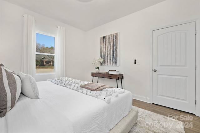 bedroom with hardwood / wood-style flooring