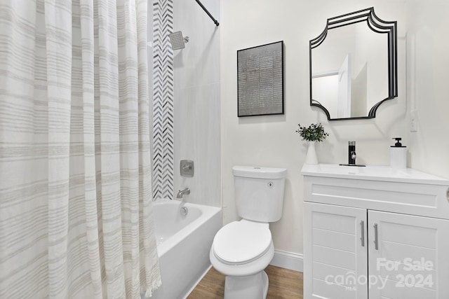 full bathroom featuring hardwood / wood-style flooring, vanity, toilet, and shower / bathtub combination with curtain