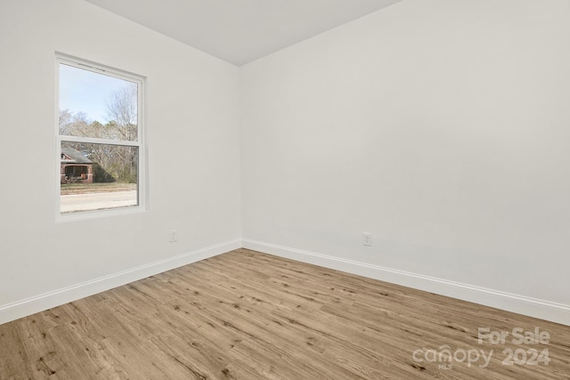 spare room with light hardwood / wood-style floors