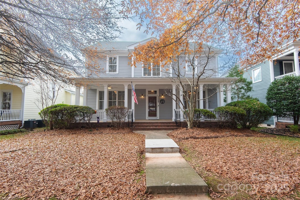 view of front facade featuring covered porch and central AC unit