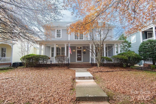 view of front facade featuring covered porch and central AC unit