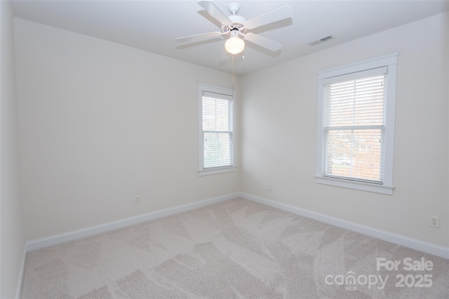 carpeted empty room with ceiling fan