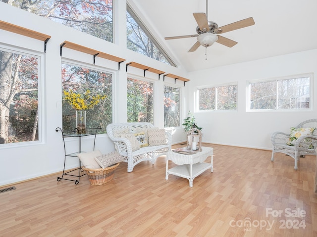 sunroom / solarium featuring ceiling fan and vaulted ceiling