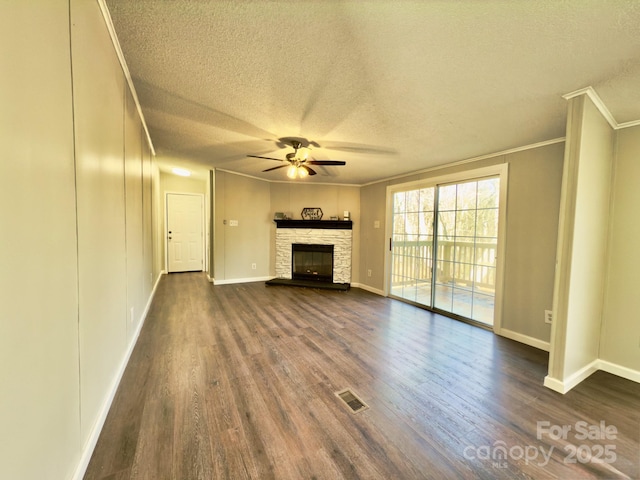 unfurnished living room featuring crown molding, dark hardwood / wood-style floors, and a fireplace