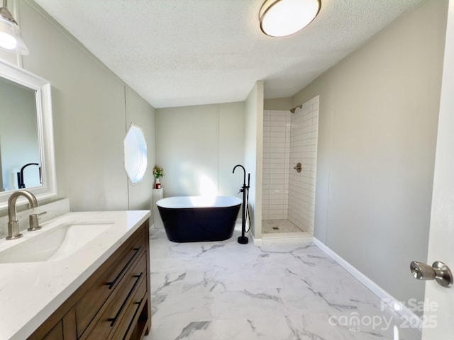 bathroom featuring vanity, plus walk in shower, and a textured ceiling