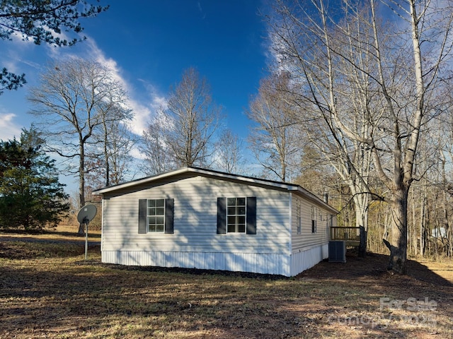 view of side of property with cooling unit