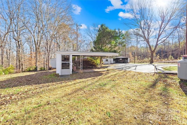 view of yard with a carport