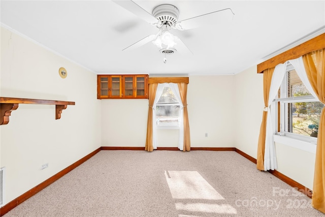 carpeted empty room with ceiling fan