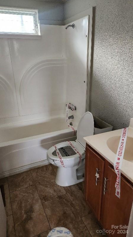 full bathroom with tile patterned flooring, vanity, toilet, and shower / bath combination