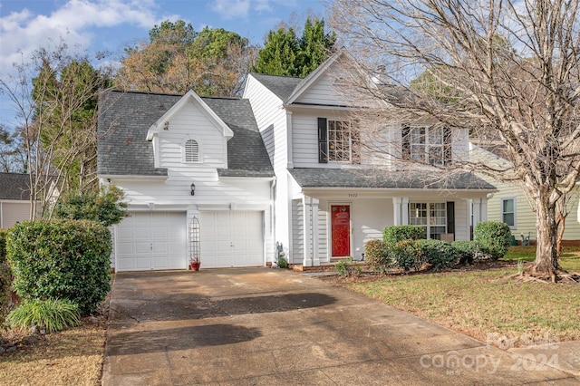 front of property featuring a garage and a front lawn