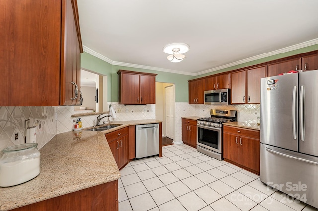 kitchen featuring backsplash, light stone counters, sink, and stainless steel appliances