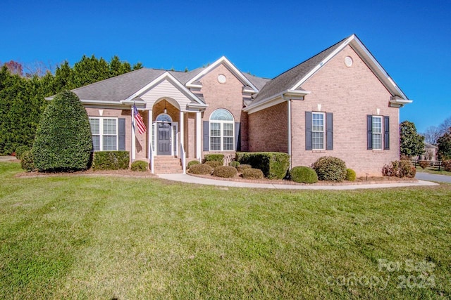 131 Quail Haven Dr, Troutman, NC 28166 - view of front of home featuring brick siding and a front lawn