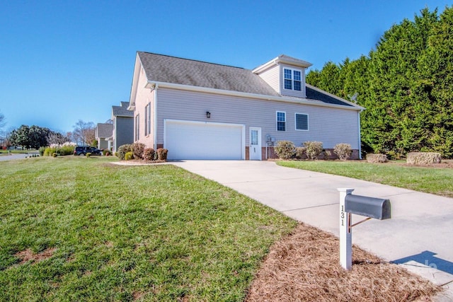 view of front of house featuring a front yard and a garage