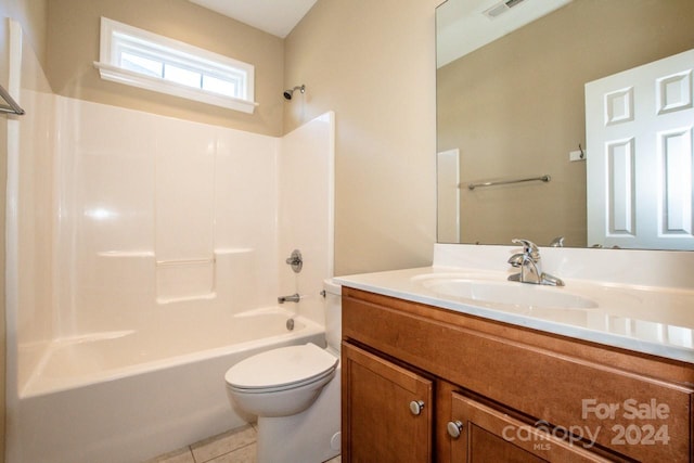 full bathroom with toilet, vanity, shower / bath combination, and tile patterned floors