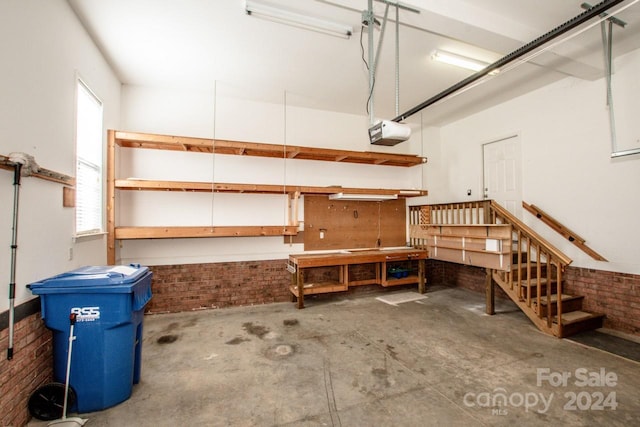 garage featuring a workshop area and a garage door opener