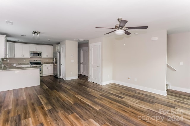 kitchen featuring white cabinets, dark hardwood / wood-style floors, sink, and stainless steel appliances