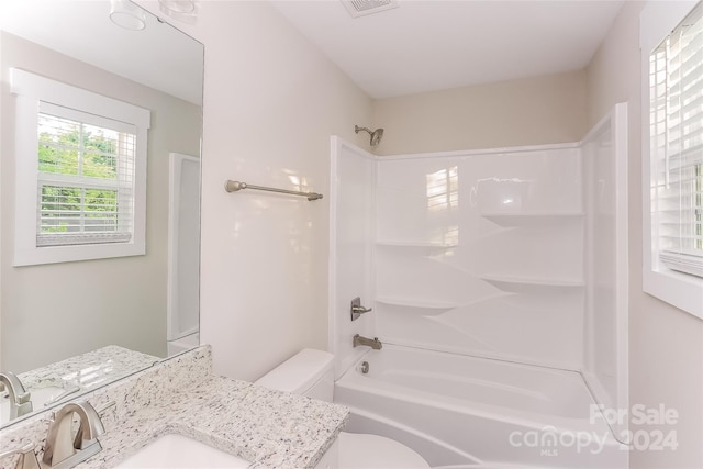 full bathroom featuring vanity, shower / bath combination, and toilet