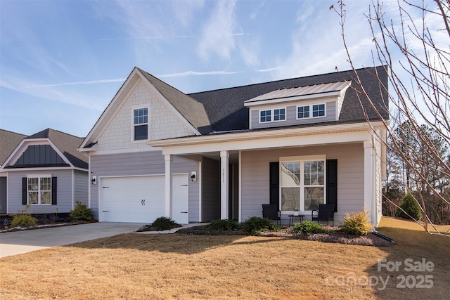 view of front of house featuring covered porch, a garage, a shingled roof, driveway, and a front lawn