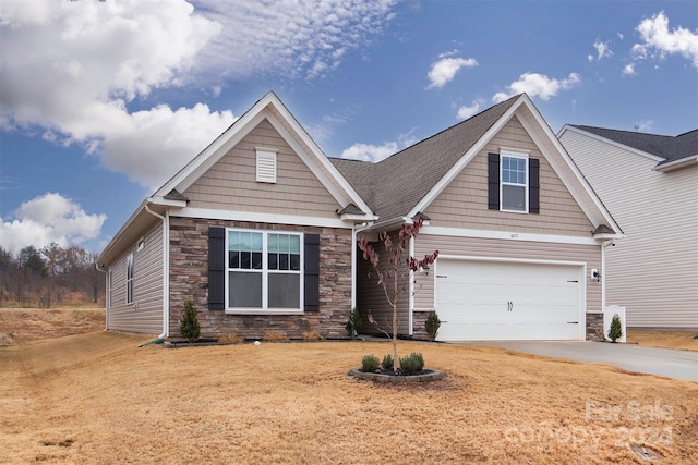 craftsman-style home with a garage