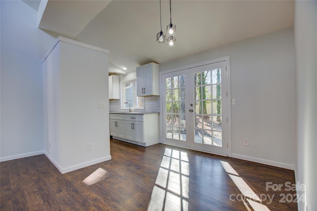 kitchen featuring white cabinetry, french doors, and dark wood-type flooring