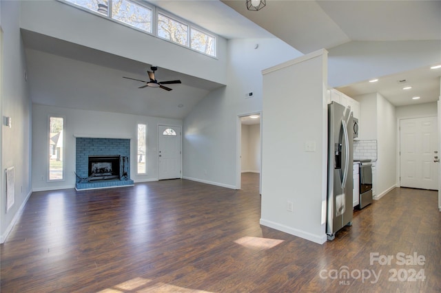 2515 Dion Ave, Charlotte, NC 28212 - unfurnished living room featuring a fireplace, dark wood-style floors, high vaulted ceiling, and ceiling fan