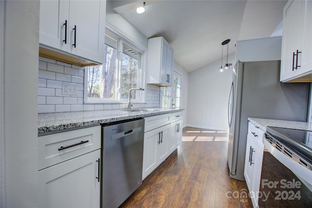 2515 Dion Ave, Charlotte, NC 28212 - kitchen featuring appliances with stainless steel finishes, backsplash, dark wood-style flooring, lofted ceiling, and light stone counters