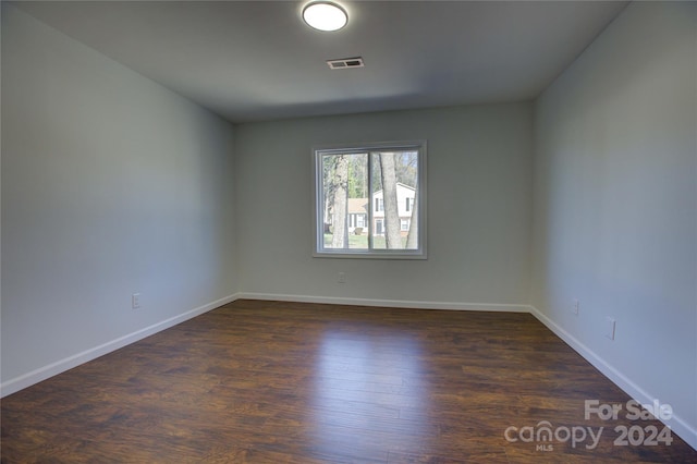 empty room featuring dark hardwood / wood-style floors